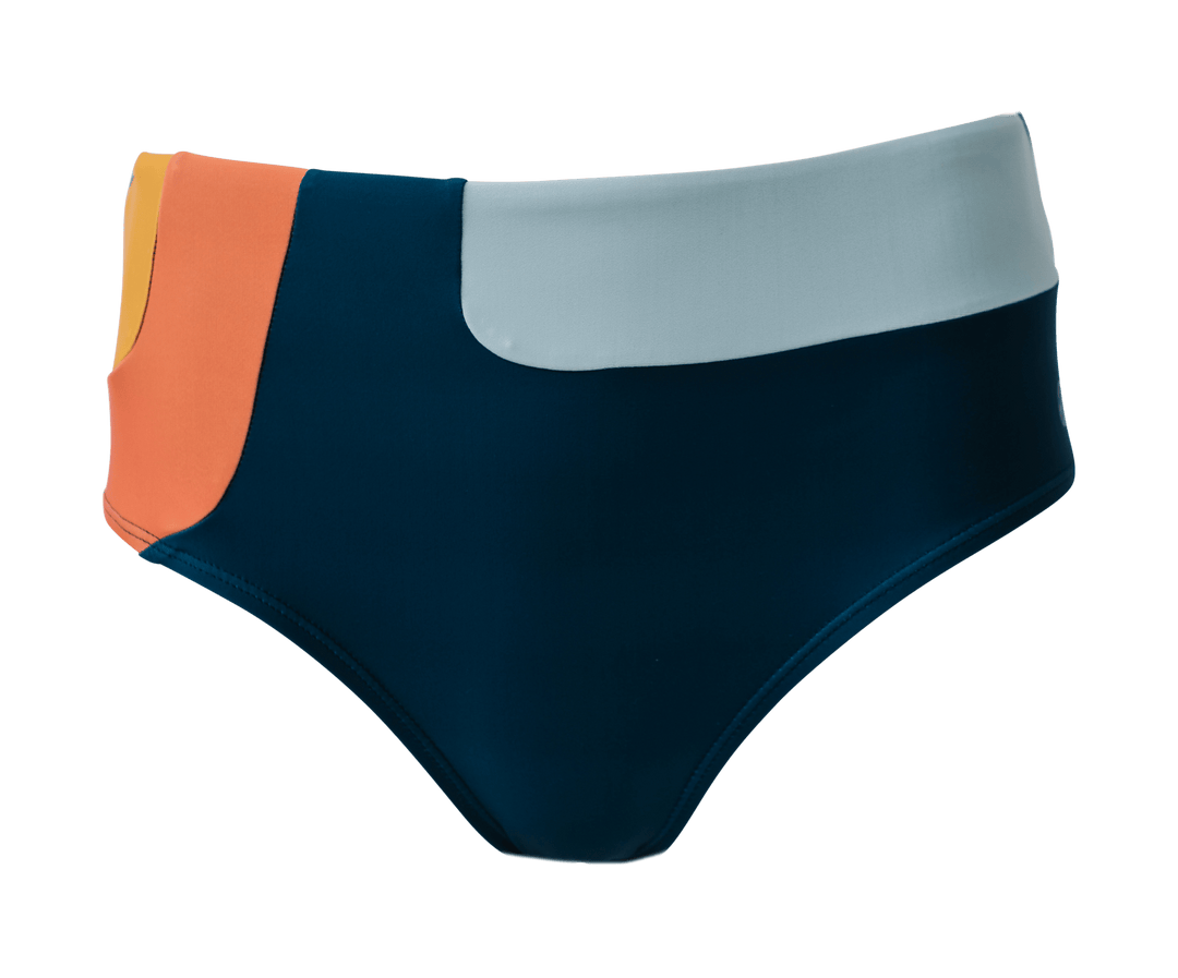 Product flat lay of a blue, white, orange, and yellow patterned swimsuit bottom.