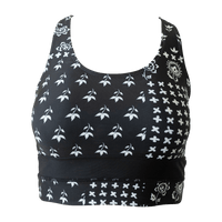 Flat lay of a black and white floral swimsuit top. 
