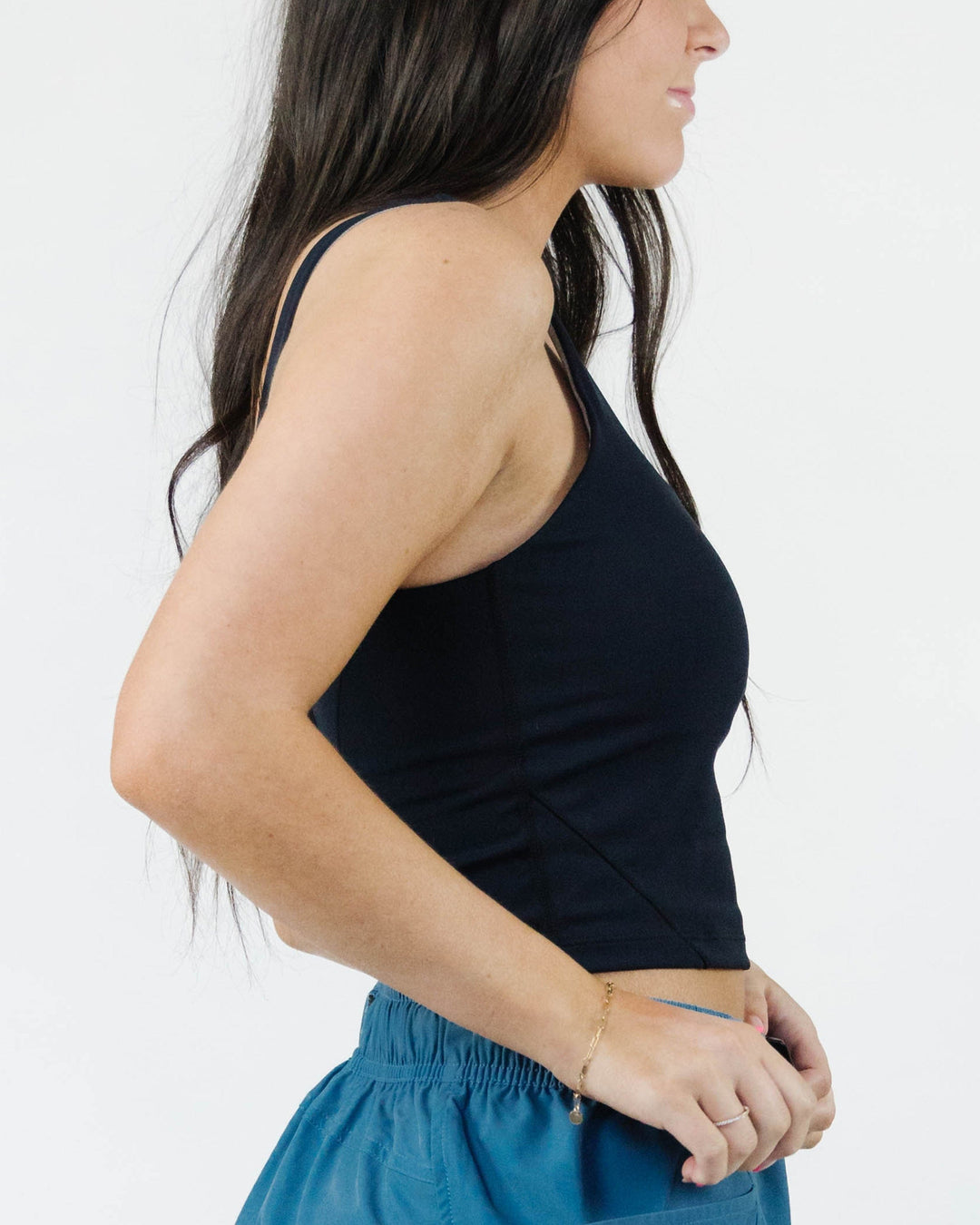 A studio image of a cropped workout top with a built in bra.