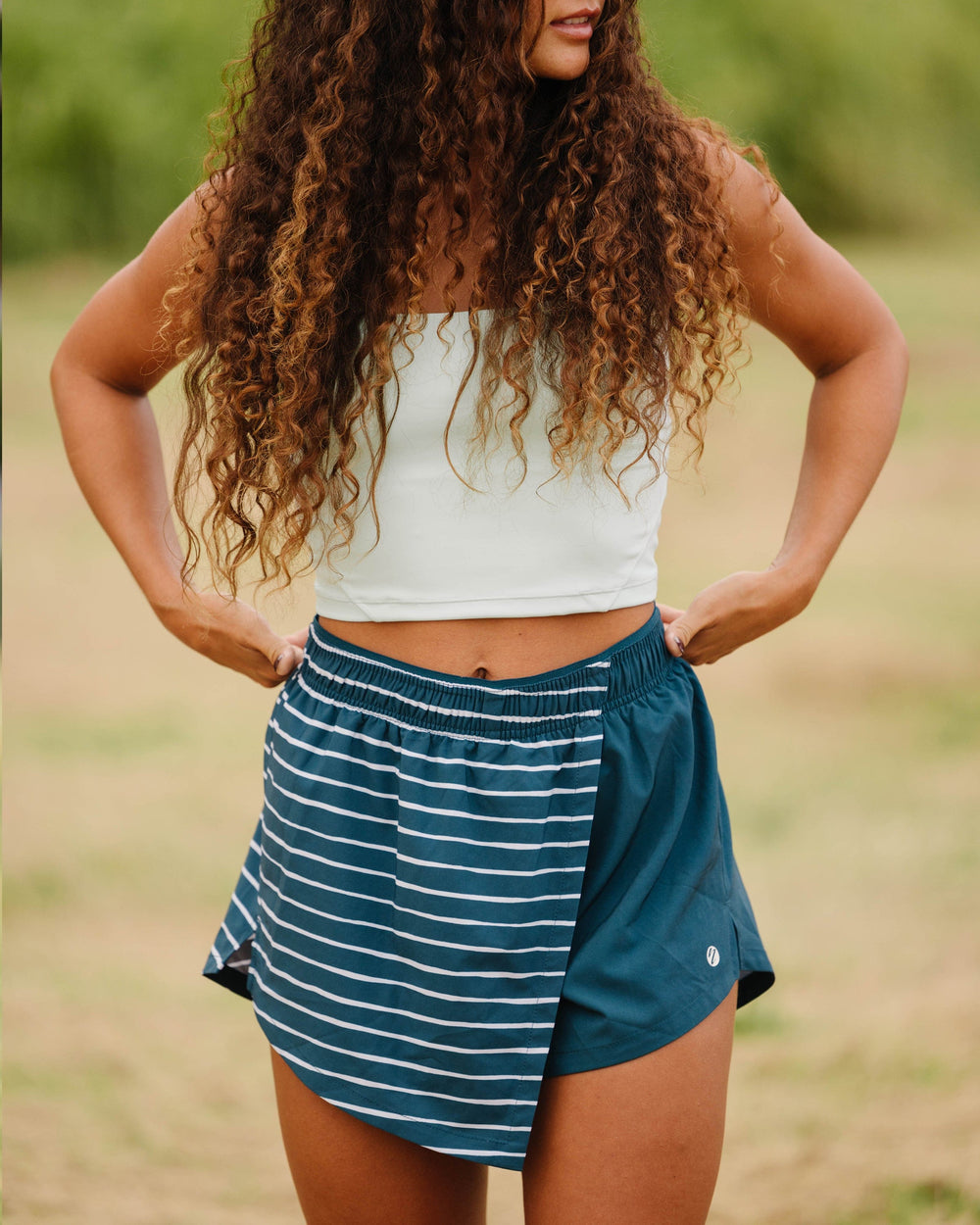 A women wearing a blue and white striped skort.